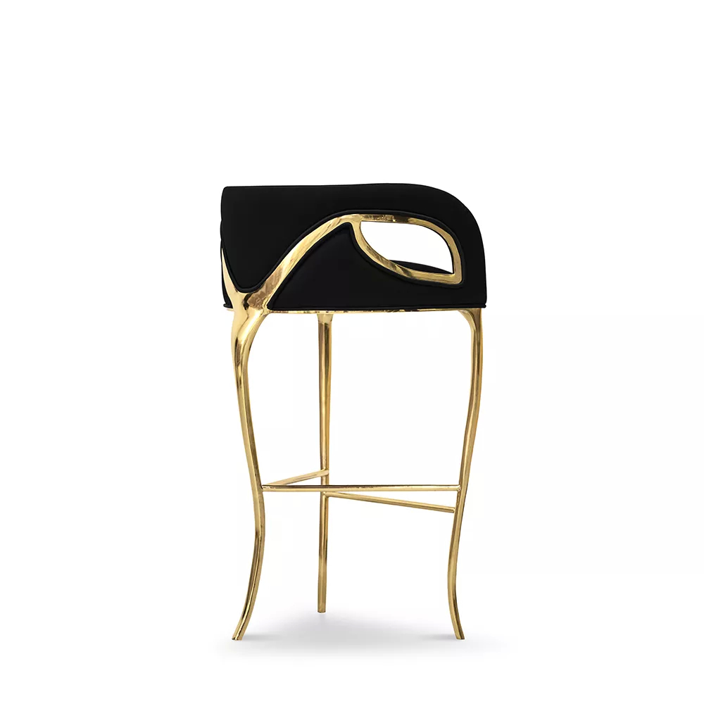 Bar stool upholstered in black with gold finish.
